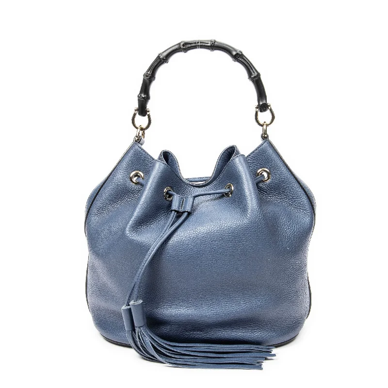 Denim Bucket Bag in Washed Blue with Patchwork for a Vintage - Inspired LookMiss Bamboo Bucket Bag