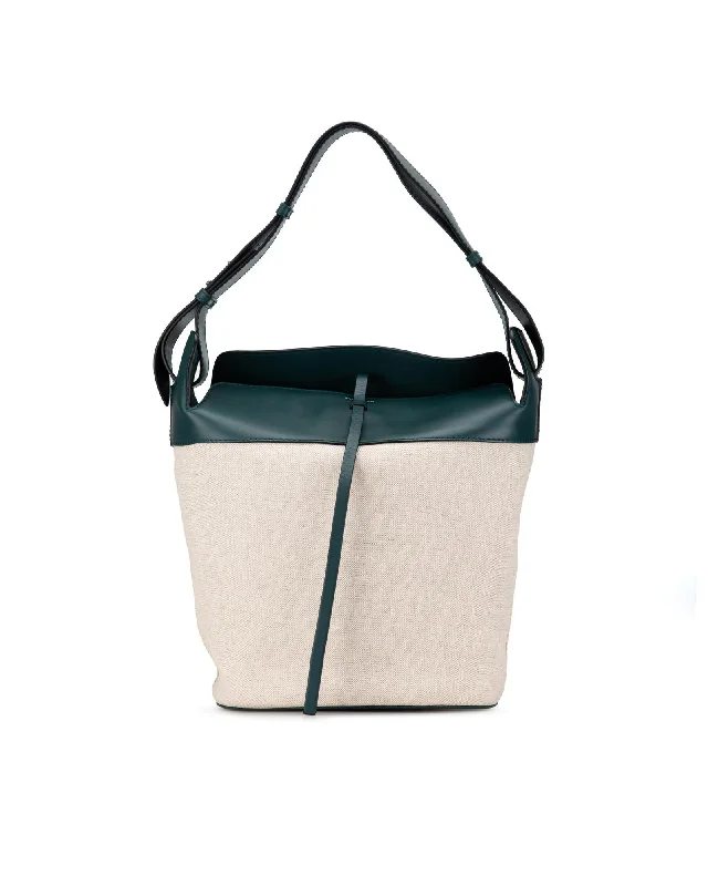 Canvas and Leather - Trimmed Bucket Bag in Beige for a Casual Weekend GetawayLeather Trimmed Canvas Bucket Bag with Flat Leather Strap